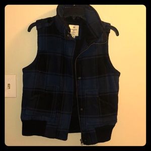 Blue and black flannel pattern vest.